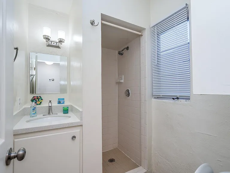 Shared bathroom. Standing shower. Quartz countertop vanity.