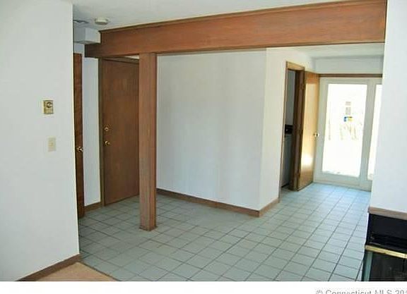 Downstairs with slider, washer/dryer and 1/2 bath