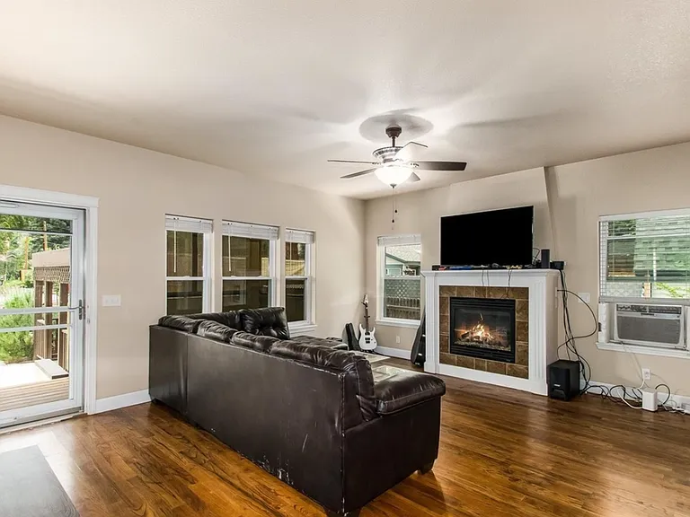Spacious living area with plenty of windows.