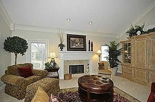 Another view of the great room reveals the intricate gas log fireplace.