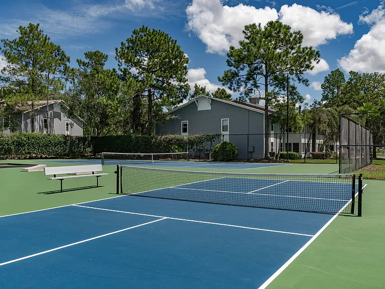 Play a pickup match on the tennis courts