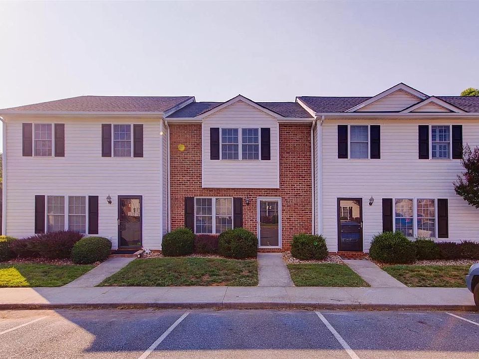 Brick front with 2 parking spots.