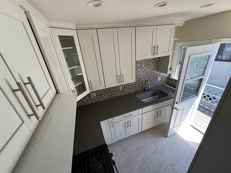 Kitchen view 2 with backdoor