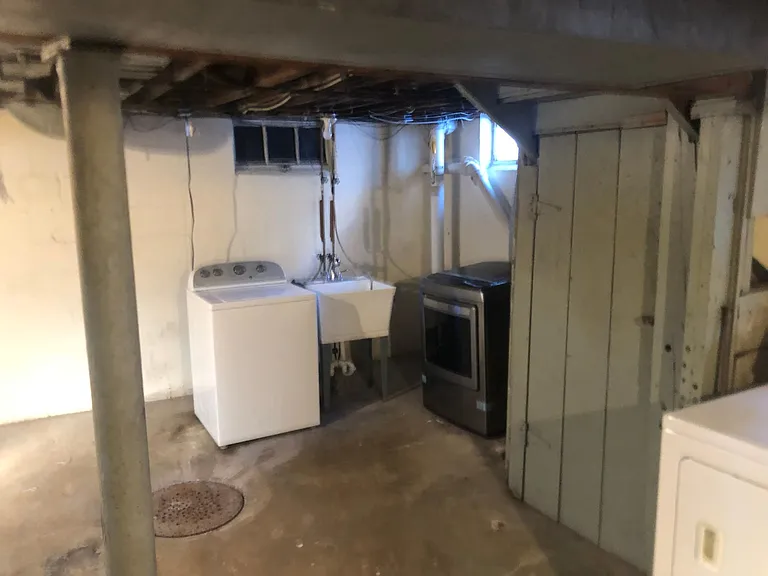 View of washer and dryer in utility basement.