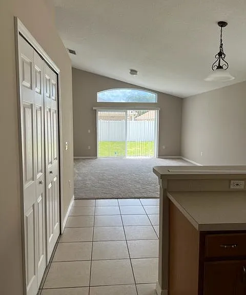 View from kitchen to Breakfast nook followed by family room. Pantry at the left