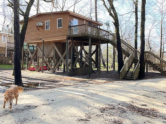 Road view and storage/workshop underneath.