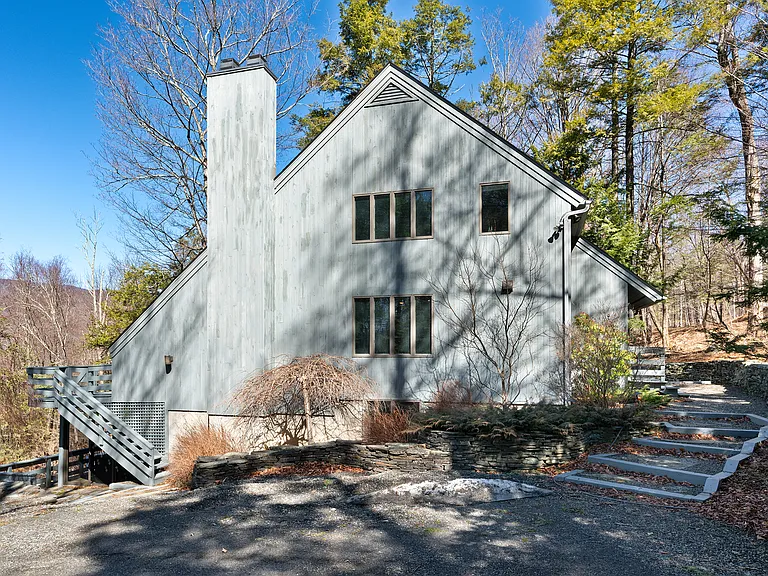 Driveway, leading to the front door.