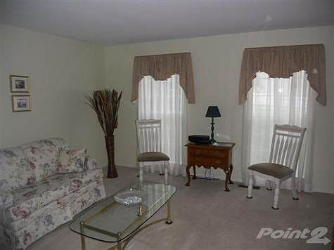 The formal living room faces the front of the home.