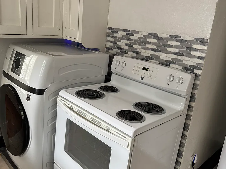 Kitchen featuring included washer/dryer unit