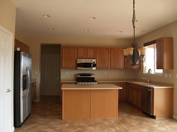 Kitchen with lots of counter space and stainless steel appliances