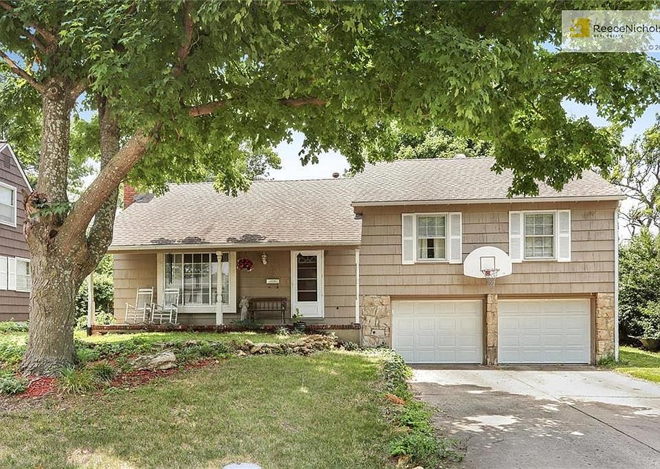 3 bedroom, 2 bath split with 2 car attached garage and darling front porch