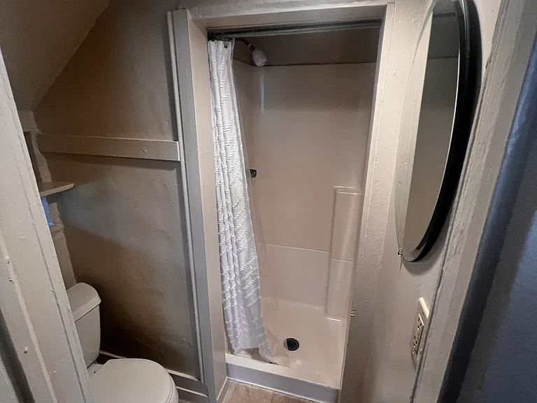 Bathroom shower and toilet (** note ** there is no bathroom sink)