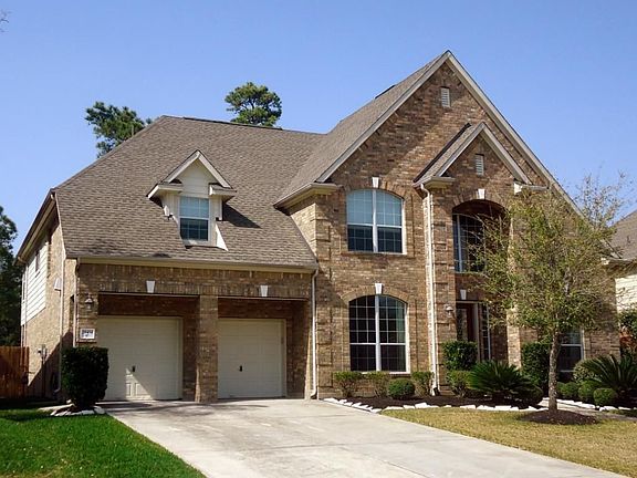 The 3-car tandem garage is artfully veiled behind a5-foot-deep porte-cochere.