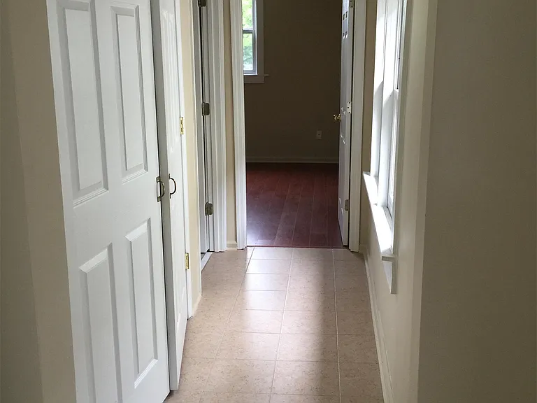 Hallway to laundry closet, bath and bedroom.