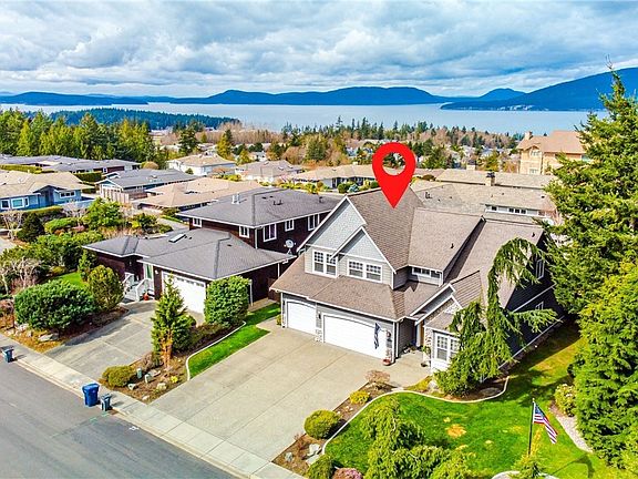 Aerial view of home showing neighborhood location and water views that are viewable from the back upper 2 bedrooms.  Great water views from those rooms!