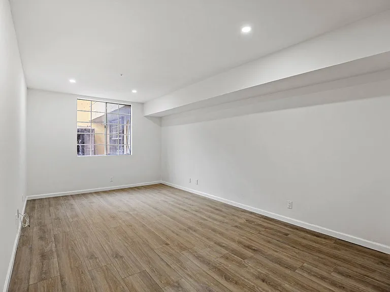Bedroom with Vinyl Flooring and Windows