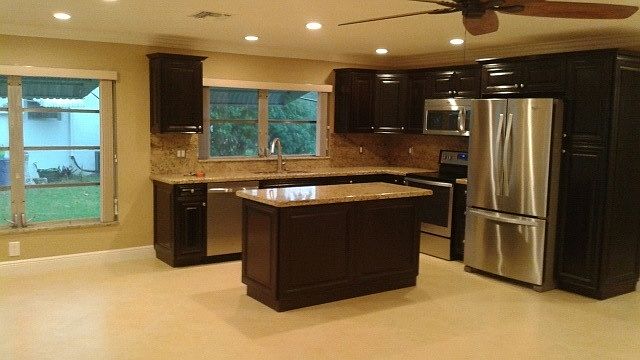 Beautiful Kitchen with Island, all wood cabinets & granite.