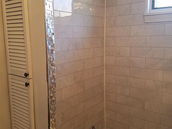 Bathroom, with new tiling in shower area