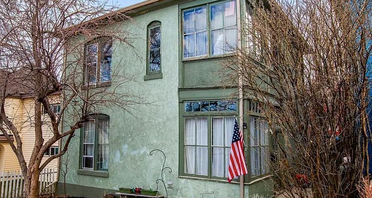 Streetside view. Front door to the right, shared with downstairs tenant. Sidewalk leads to an ample back yard. This apartment includes the entire second floor, including sunspace above porch. This is a nice quiet neighborhood!