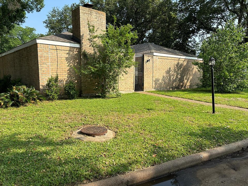 Front door with a private patio with iron gate