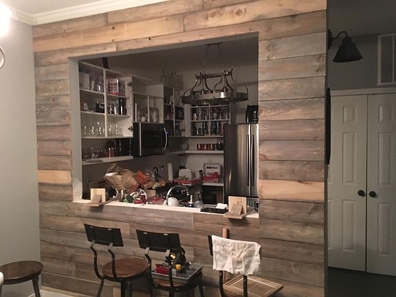 Kitchen in remodeling process. Currently all cabinet doors have been finished, and new countertops, new sink and back splash installed. New Garbage disposal unit, and brand new copper/gold handles and light fixture. Also, a rustic seating breakfast coun