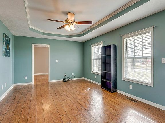 Large bright family room with tray ceiling