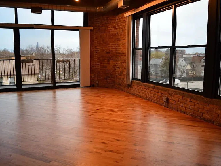 Beautiful hardwood floors and exposed brick
