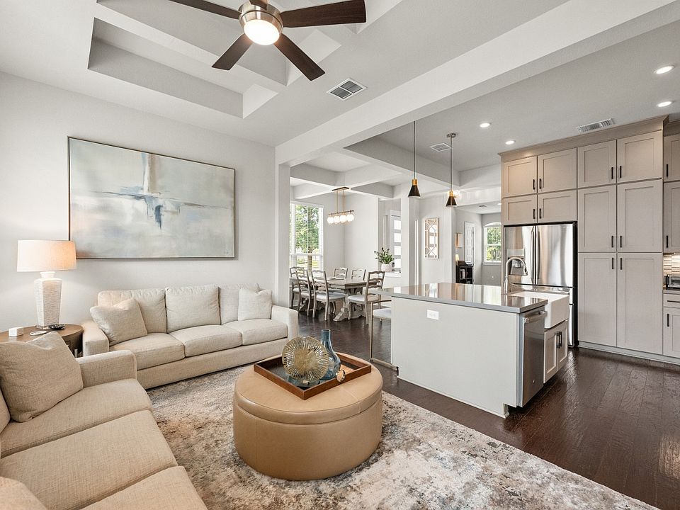 Living room featuring dark wood-style floors, a ceiling fan, recessed lighting, and beamed ceiling