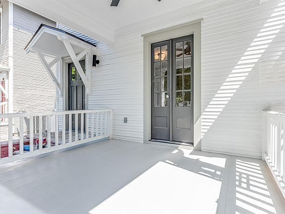 Private Front porch/deck accessible from the living room.