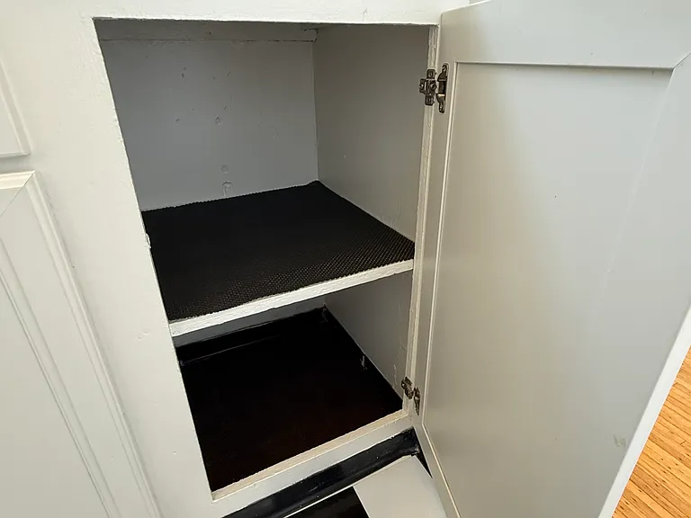 Super-clean, freshly painted kitchen cupboards.
