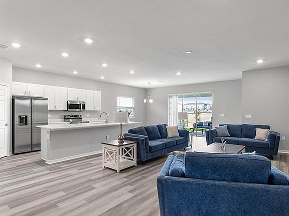Enjoy a light-filled, open-concept living area - Aubrey by Highland Homes