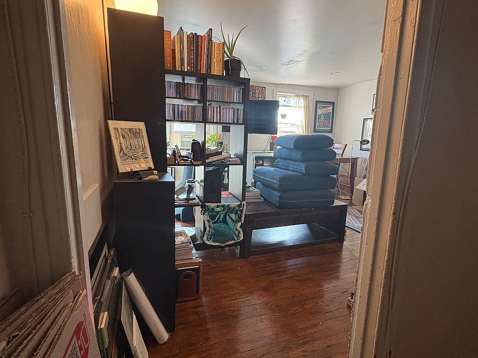 Enter large approximately 16 by 16 foot living room, with two windows overlooking Main Street.