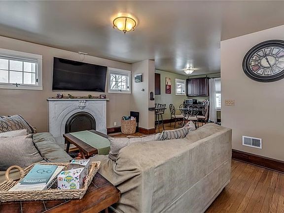 Spacious Living Room with Hardwood Flooring and a Neutral Palette