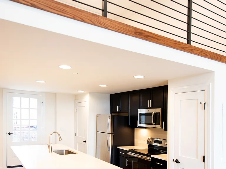 Explore this bright and contemporary kitchen with stylish black finishes.