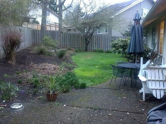 Fenced Backyard.  Garden is around the corner on right