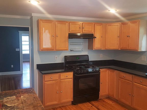 Kitchen looking into Dining & Living rooms