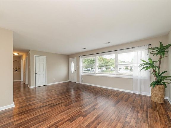 Open Concept Living Space - pergo plank wood laminate flooring installed 2014