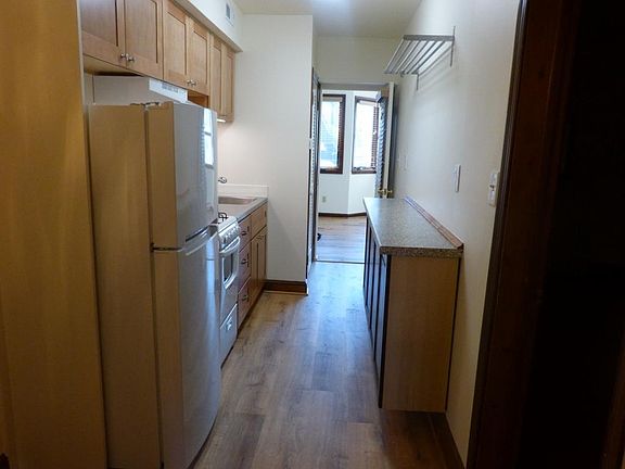 Kitchen and doorway to sunny back bedroom
