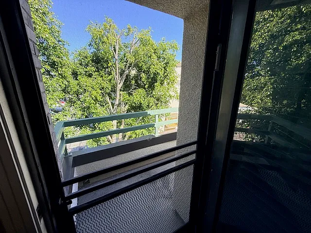 Primary bedroom features a balcony