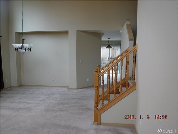 Dining area in open concept entry, living room and dining area