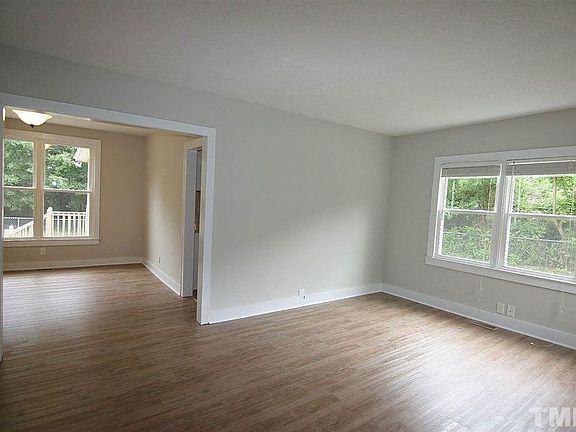 Semi open living room, dining room area with plenty of natural lighting