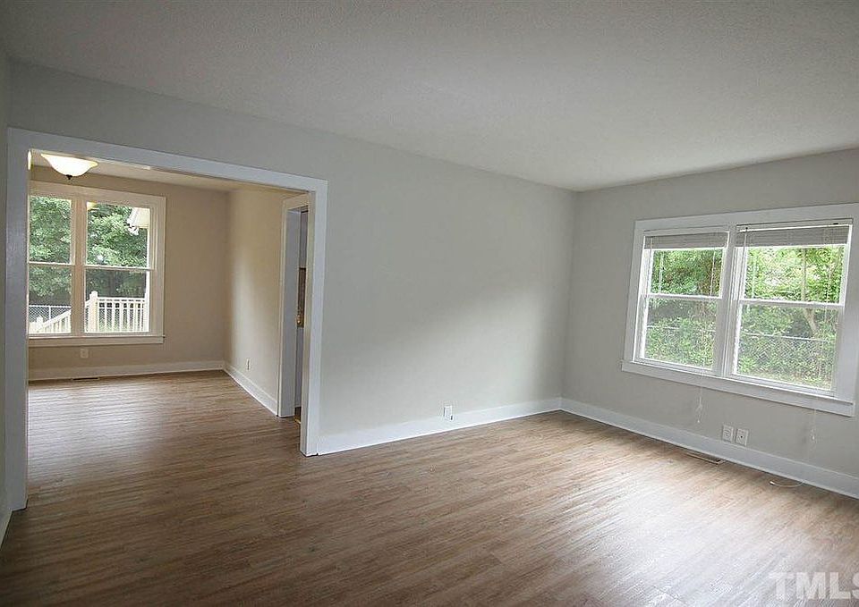 Semi open living room, dining room area with plenty of natural lighting