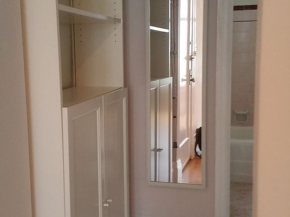View from living room to bathroom. Kitchen is on the right.