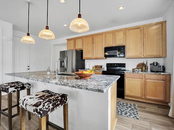 Spacious Kitchen With Center Island And Convenient Pantry