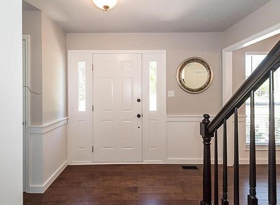A view of the entry door system.  Notice the trim accents and cased opening to the Dining Room on the right.