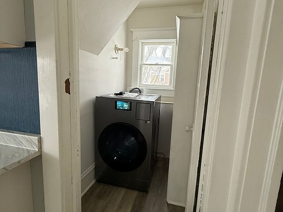 Laundry room with new Samsung all-in-one washer and dryer