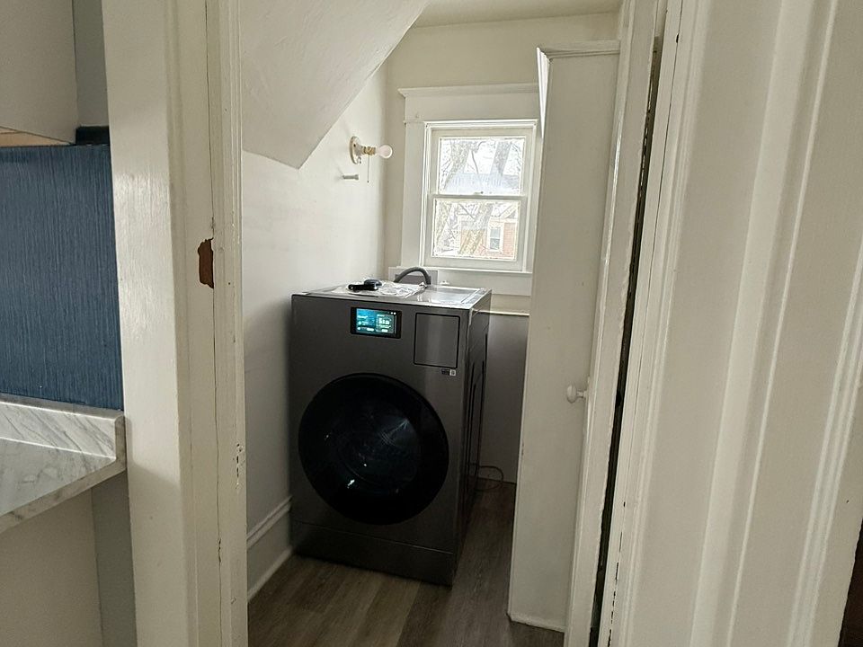 Laundry room with new Samsung all-in-one washer and dryer