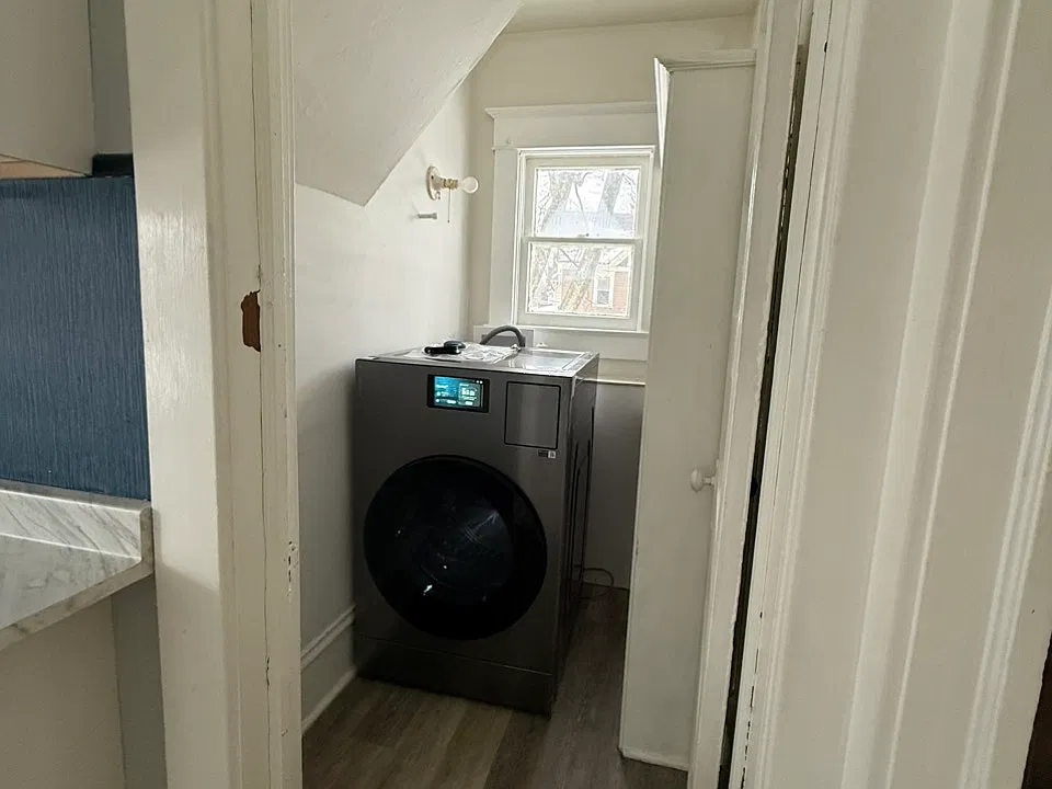 Laundry room with new Samsung all-in-one washer and dryer