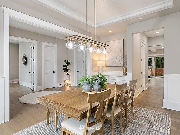Beautiful details in the formal dining room with a shiplap tray ceiling and wainscot walls.