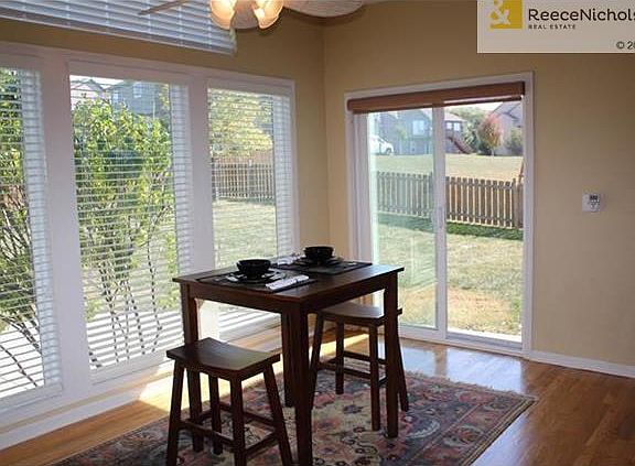 The light and bright dining area has beautiful views of the large fenced backyard and spacious patio.